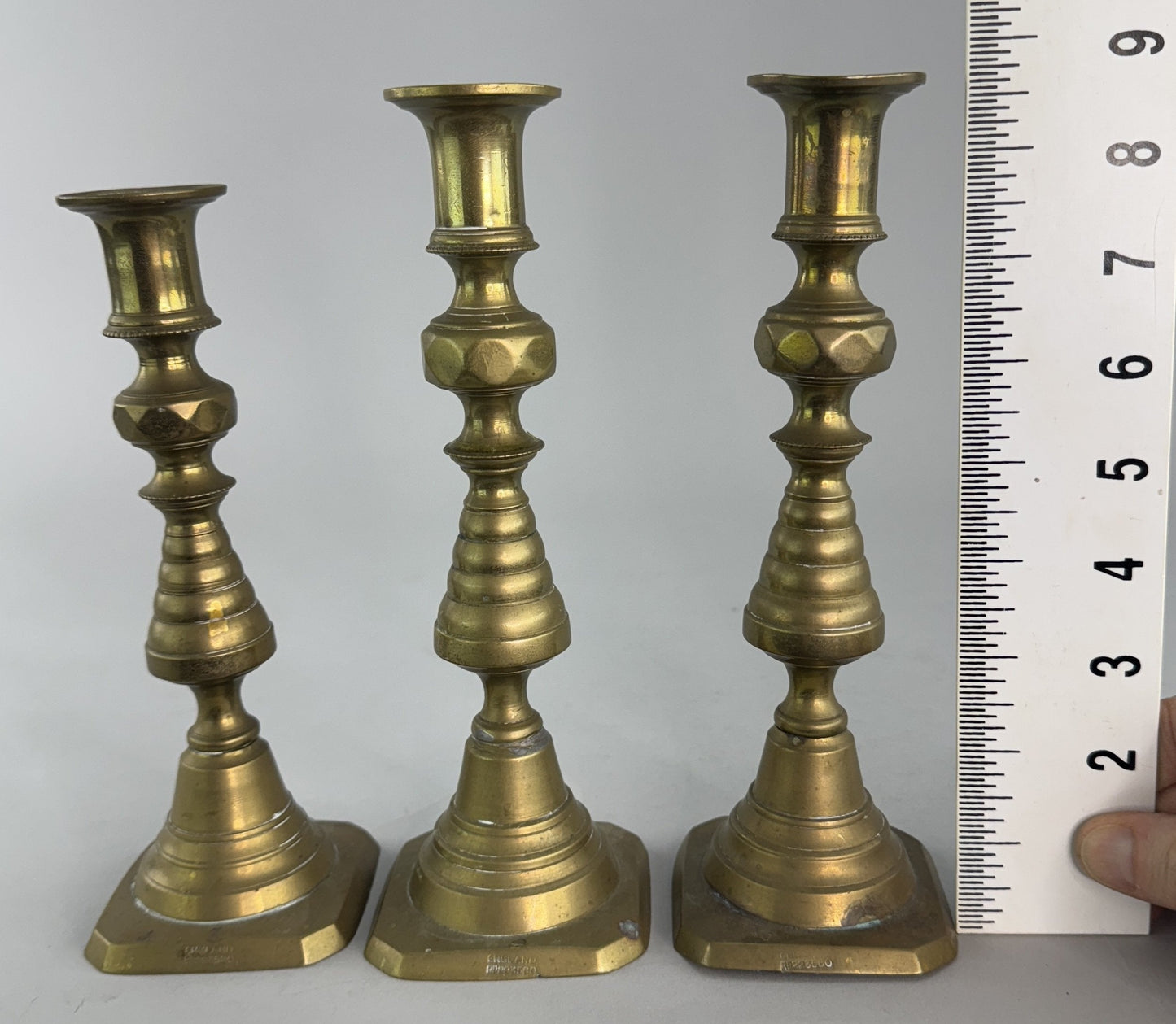 Neat Group 3 English Victorian Brass Push Up Faceted Candlestick Holders