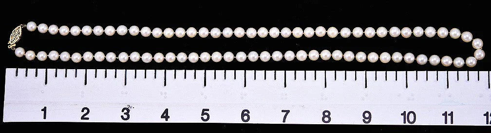 Lovely Necklace of Individually Knotted White Pearls and 14k Yellow Gold Clasp