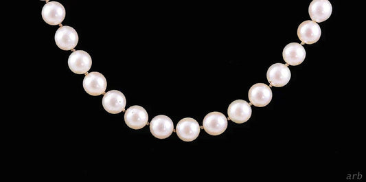 Lovely Necklace of Individually Knotted White Pearls and 14k Yellow Gold Clasp