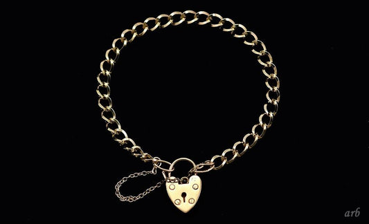 Vintage 1977 English 9k Yellow Gold Charm Bracelet with Heart Shaped Lock