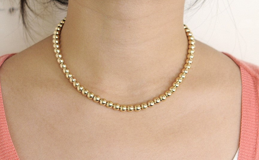 Fantastic Modern Necklace Strand of 6.5mm 14K Gold Beads