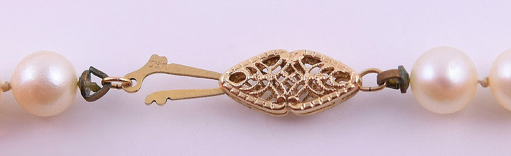 Lovely Necklace of Individually Knotted White Pearls and 14k Yellow Gold Clasp